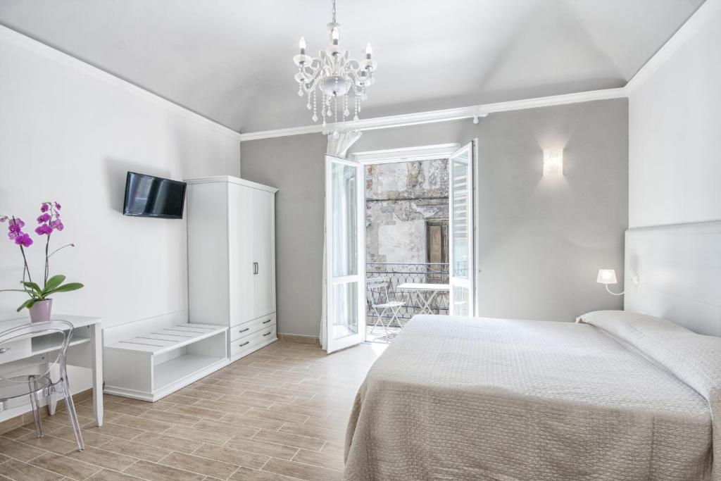 Bright guest room opening onto a balcony